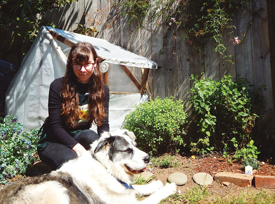 
Inspired reader Jackilyn Andrews enjoys her California garden with her Great Pyrenees mix, Gabby. Jackilyn dreams of someday building her own home.  
